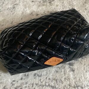 Patent leather bag. Whether used for makeup or as a clutch